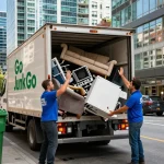 Go Junk Go team performing target Junk Removal Vancouver service on a busy city street.